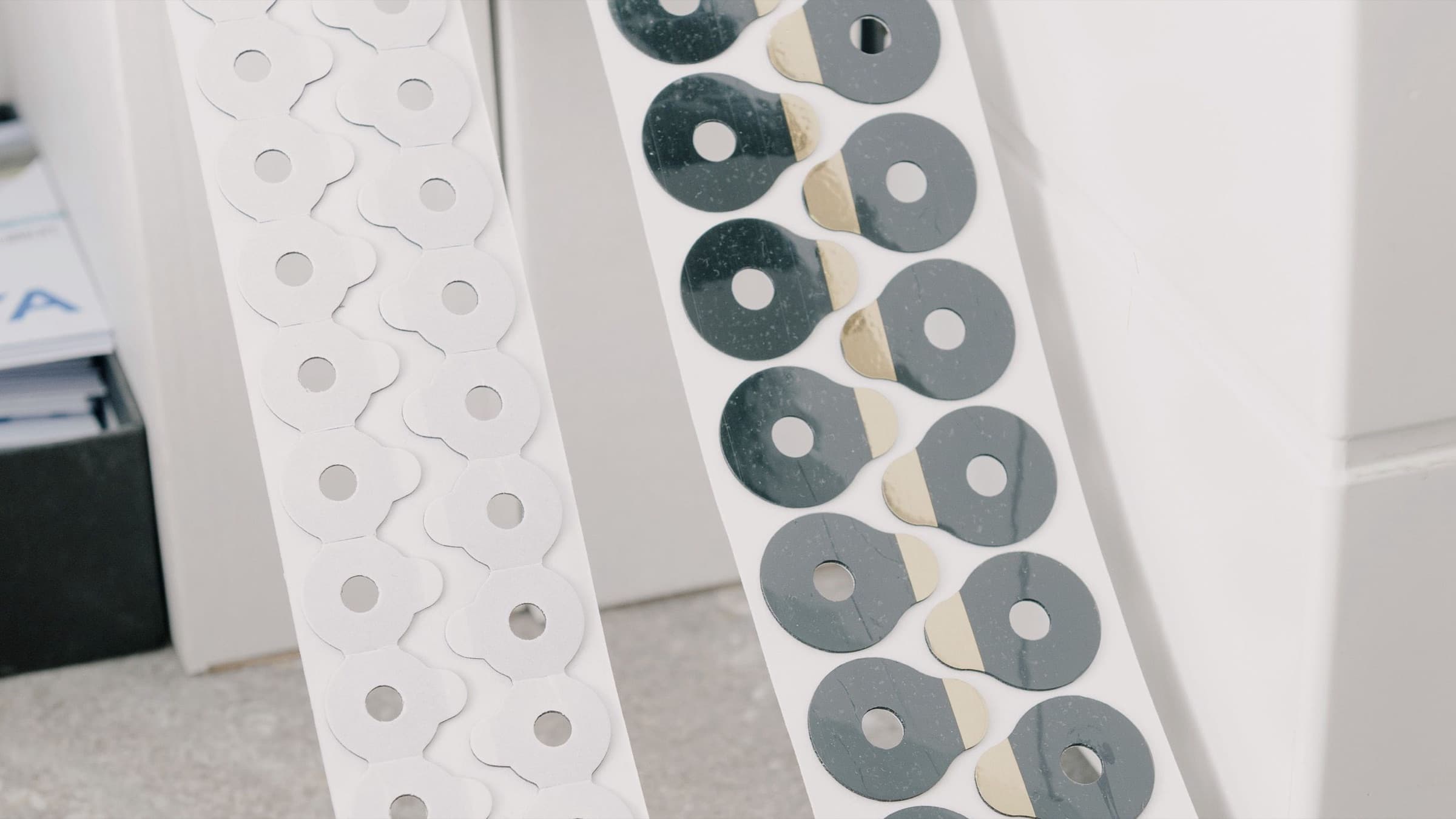 Rolls of adhesive pads on a release liner